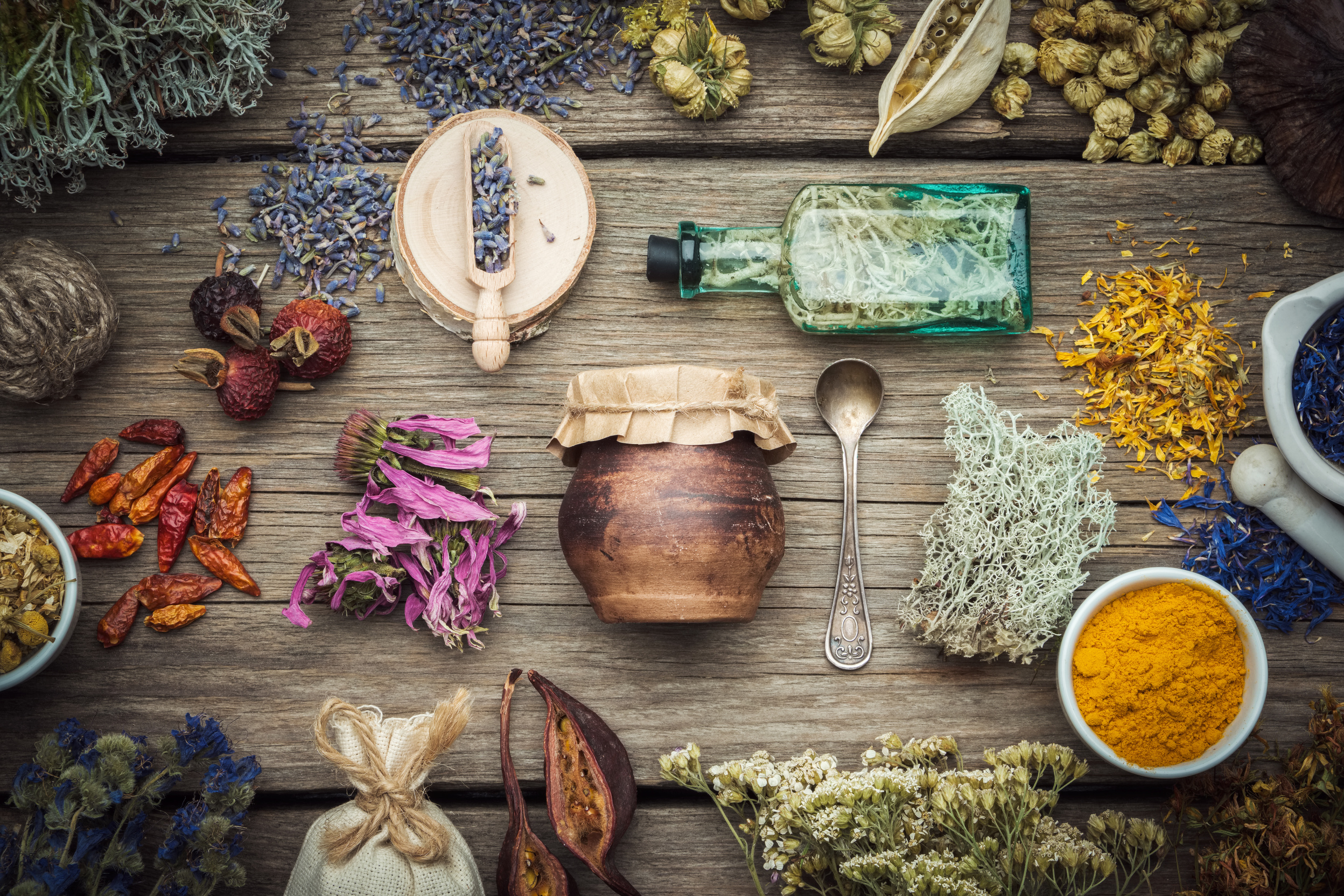 Dried Medicinal Herbs on a Wooden Board 